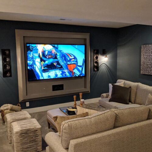 modern postmodern family media room in wall speakers